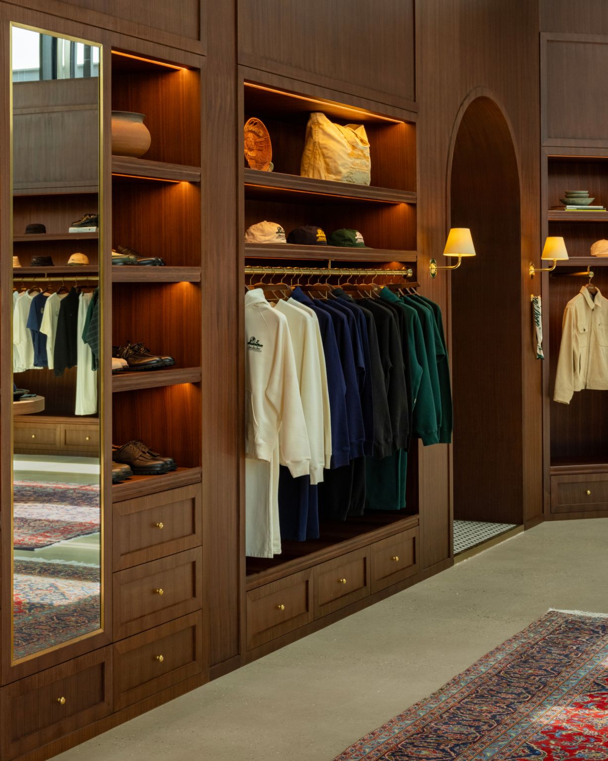 A refined merchandising wall with tonal apparel, footwear and accessories